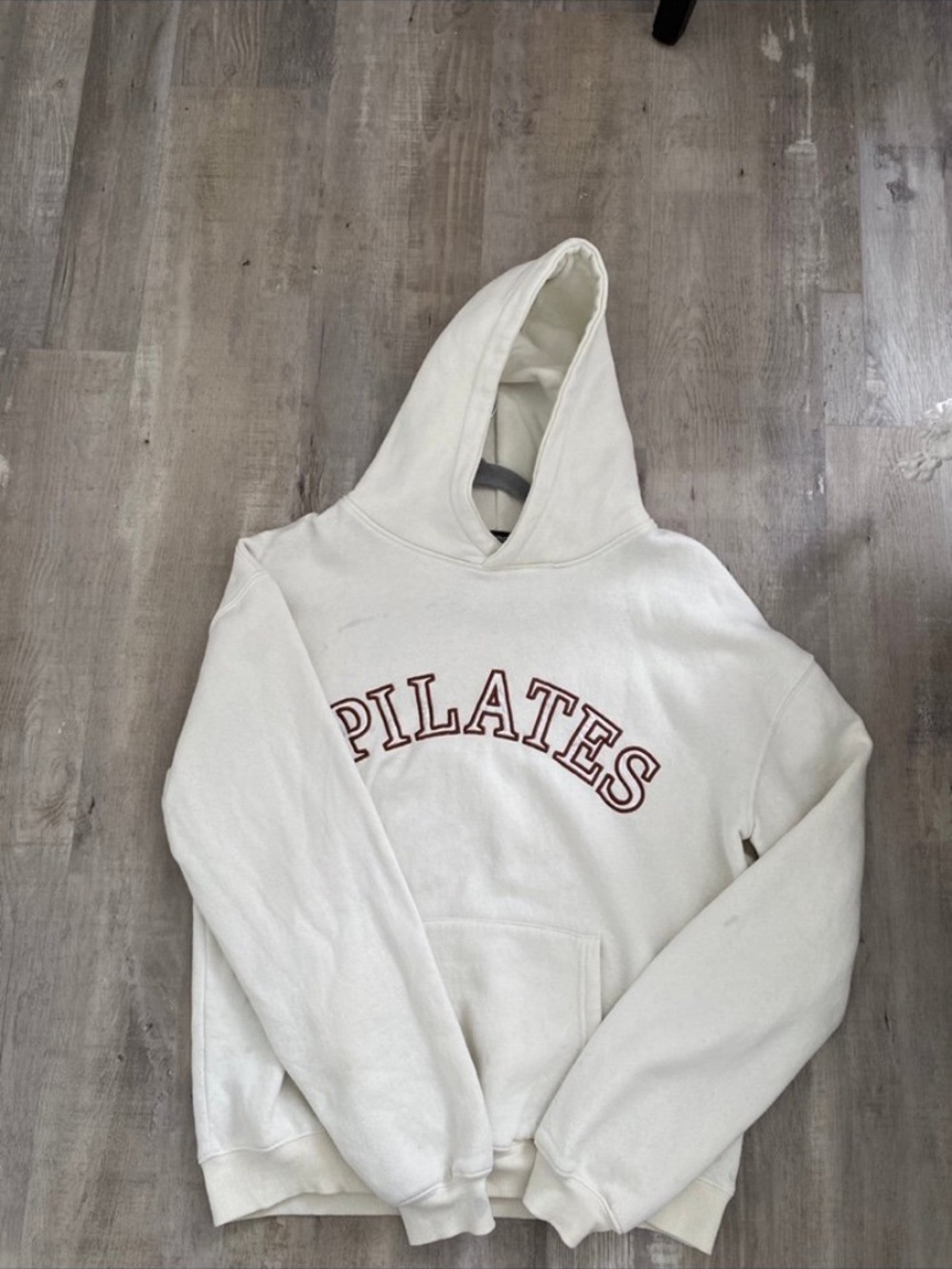 PrettyLittleThing Cream Hoodie with Rust 'PILATES' Arch